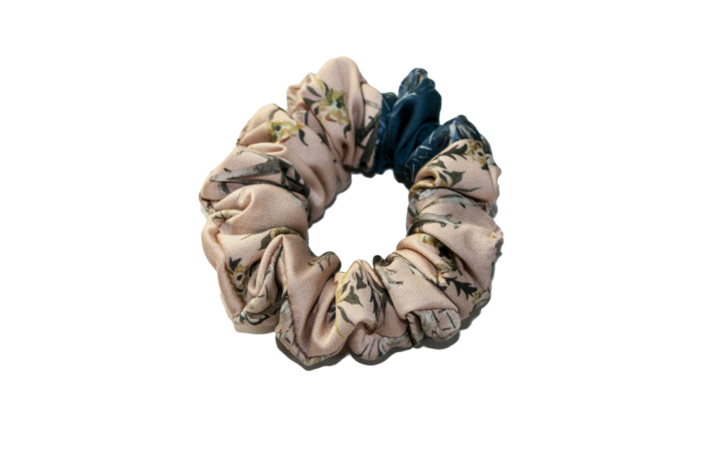 Two-toned scrunchies made from printed Satin. two thirds are desert sand colored and one third is blue.